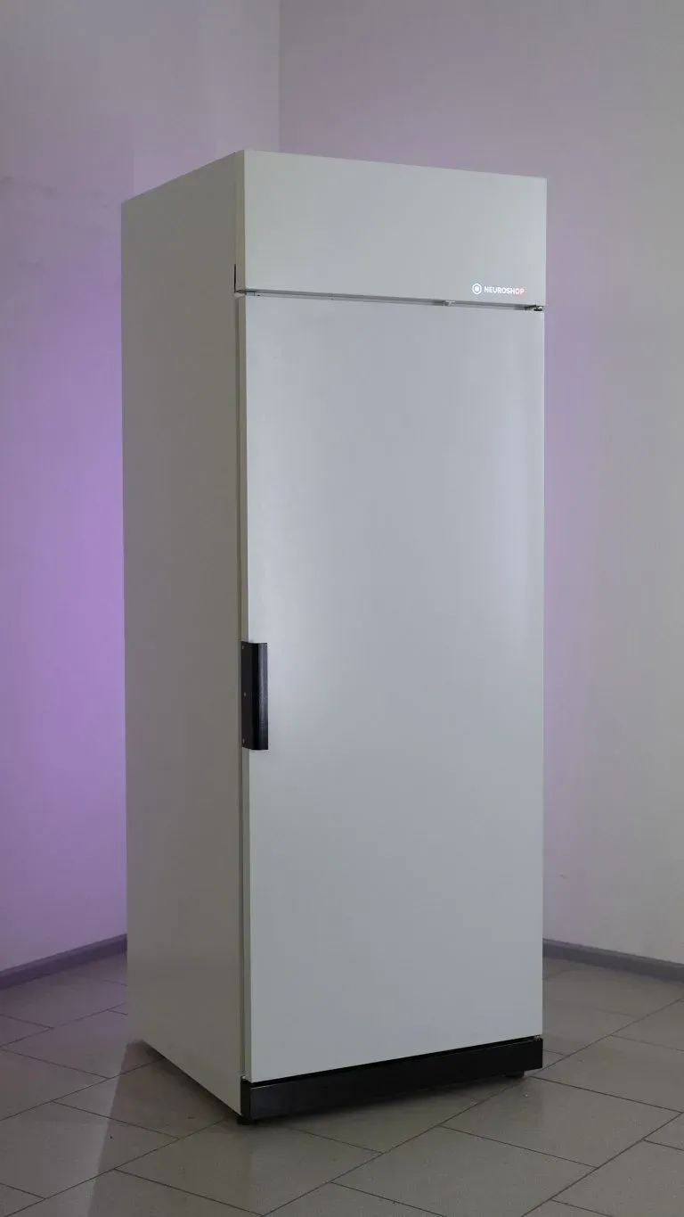 White cabinet with a closed solid door and a vertical handle