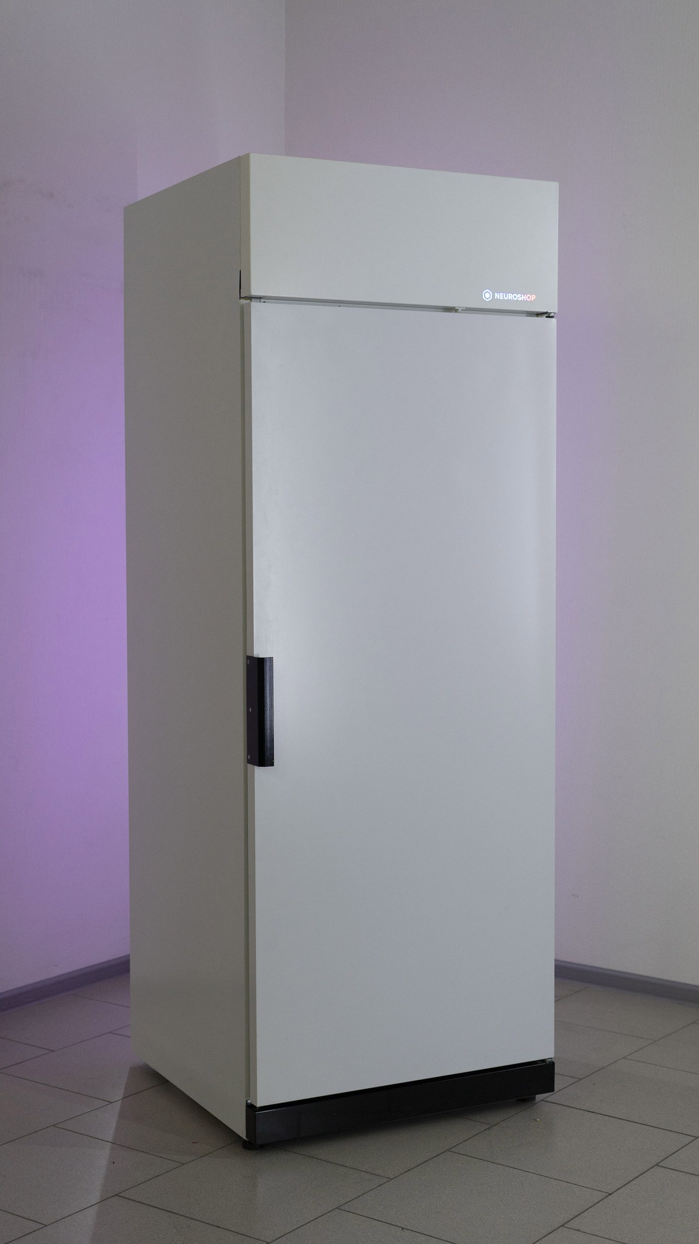 White cabinet with a closed solid door and a vertical handle